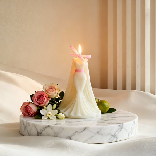 Candle shaped like a wedding dress with flowers on a marble base